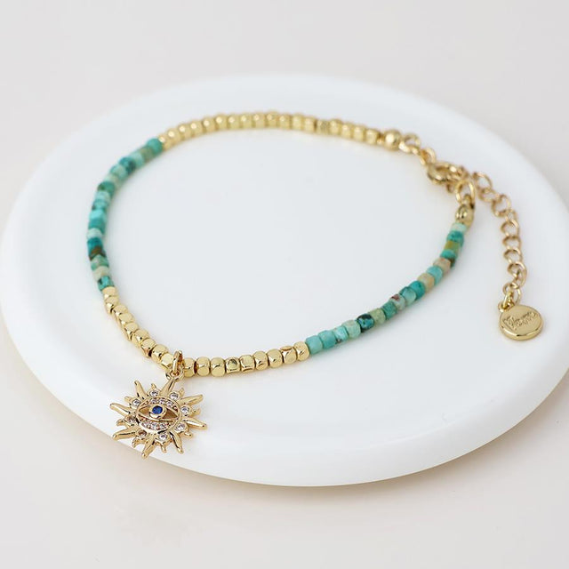 Faux Gold Turquoise Bead Sun Charm Bracelet Close Up