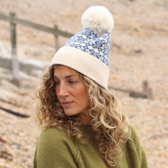 Blue & Cream Mix Scandi Star Flower Hat With Faux Fur Pompom on Model