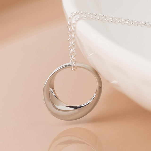 Silver Smooth Ring Pendant on Curb Chain Necklace Close Up