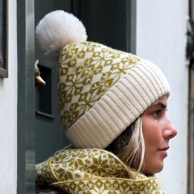 Olive Green & Cream Mix Scandi Star Flower Hat With Faux Fur Pompom on Model