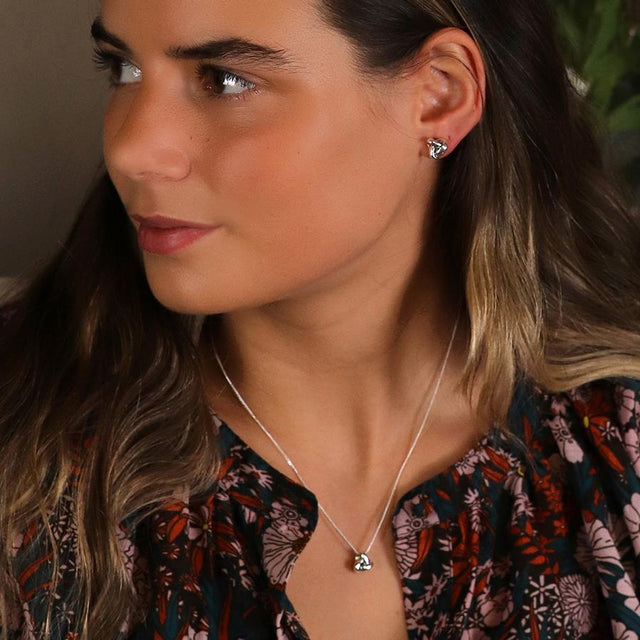 Silver Textured Infinity Knot Necklace Modelled on Model